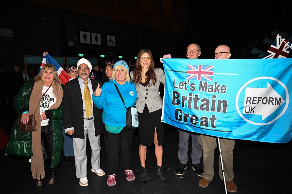 Laila with Reform UK supporters holding campaign banner