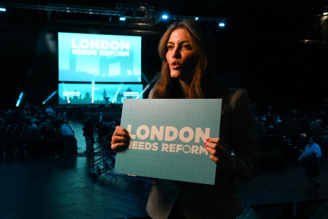 Laila holding London Needs Reform sign at rally